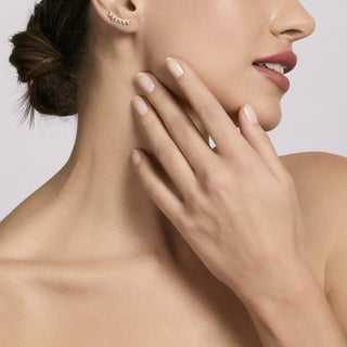 Orecchini rampicanti in argento dorato con zirconi