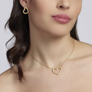 Orecchini a cuore in argento dorato con zirconi